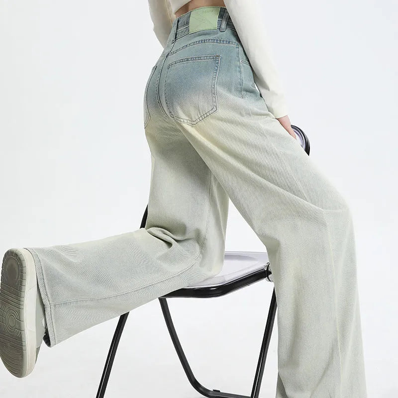 Women's gradient blue straight-leg wide leg cotton denim trousers laid flat.
