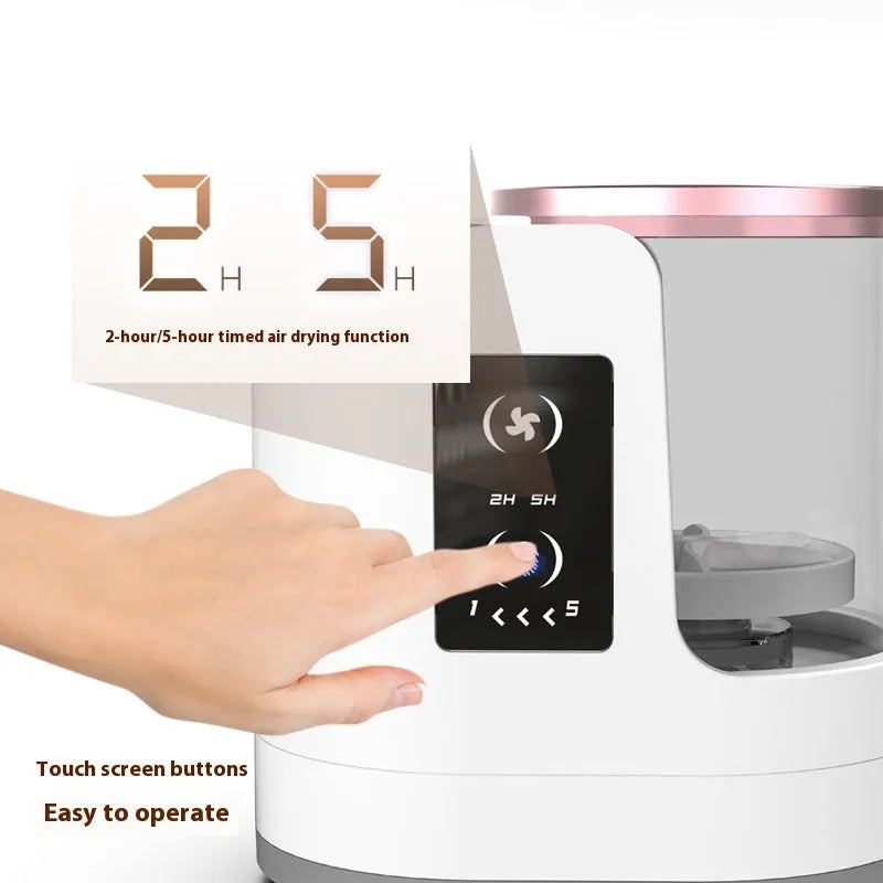 Automatic makeup brush cleaner with drying chamber showing brush holder and control buttons