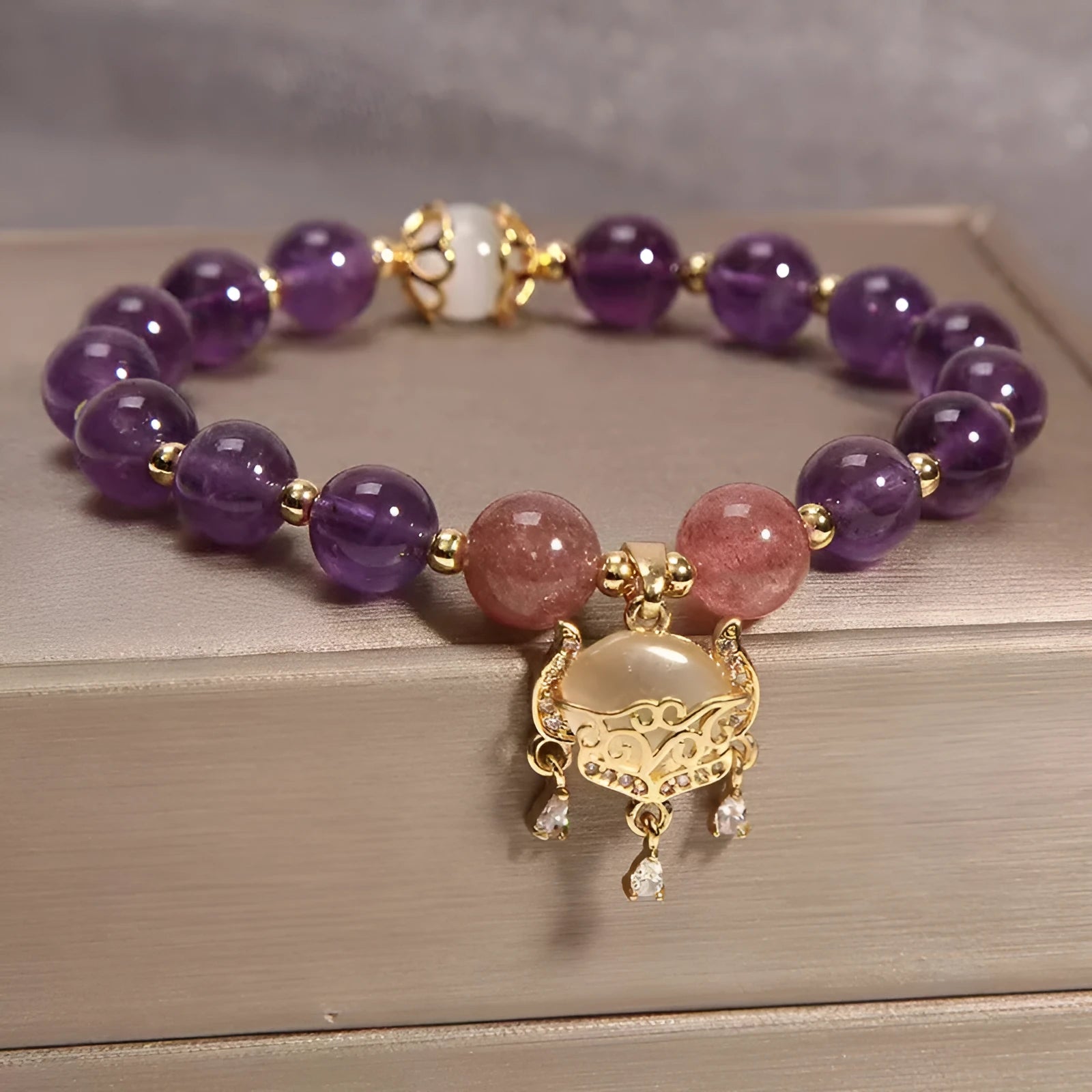 Handmade women's copper bracelet with natural amethyst crystal and gold longevity lock in retro style.