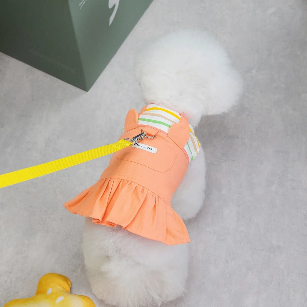 Orange and yellow striped patchwork dog skirt on canine model showing cotton fabric texture and sizing