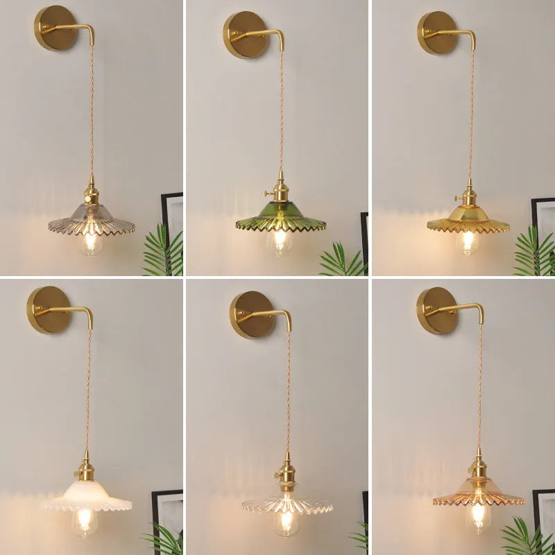 Retro copper lotus wall lamp with glass shade in choice of six colours on a wall.