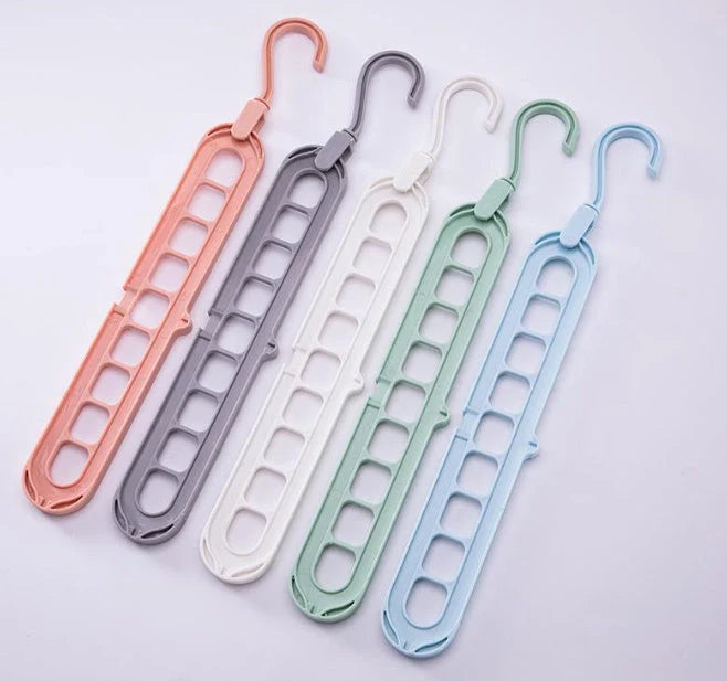 9-hole clothes hanger organizer in white, green, gray, and pink options