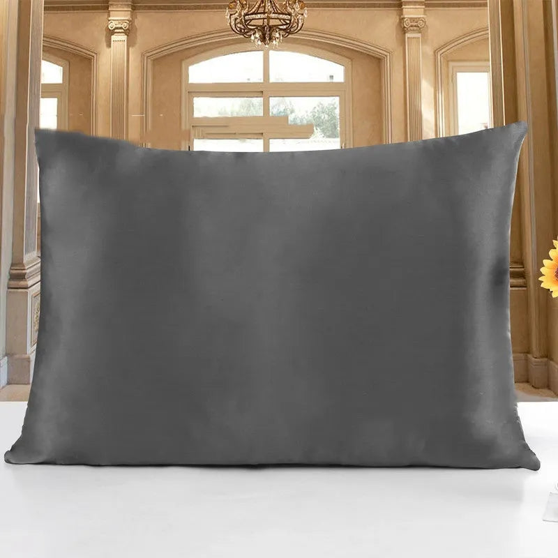 19 M double-sided silk pillowcase shown in one of 14 colours, including apricot, champagne, and navy blue.