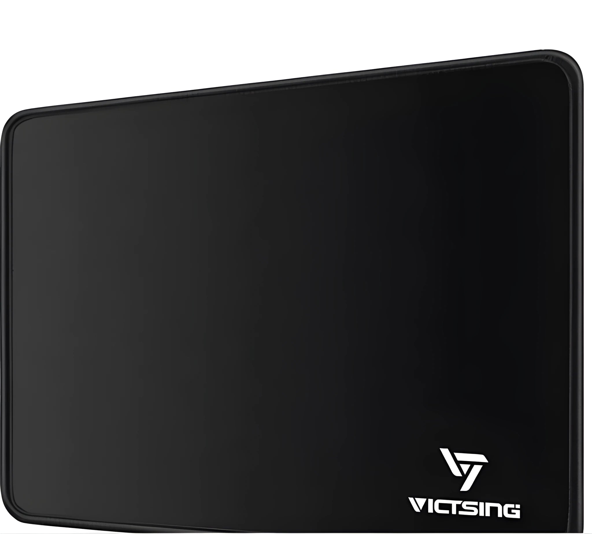 Black thickened rubber mouse pad with rough grain surface texture on desk