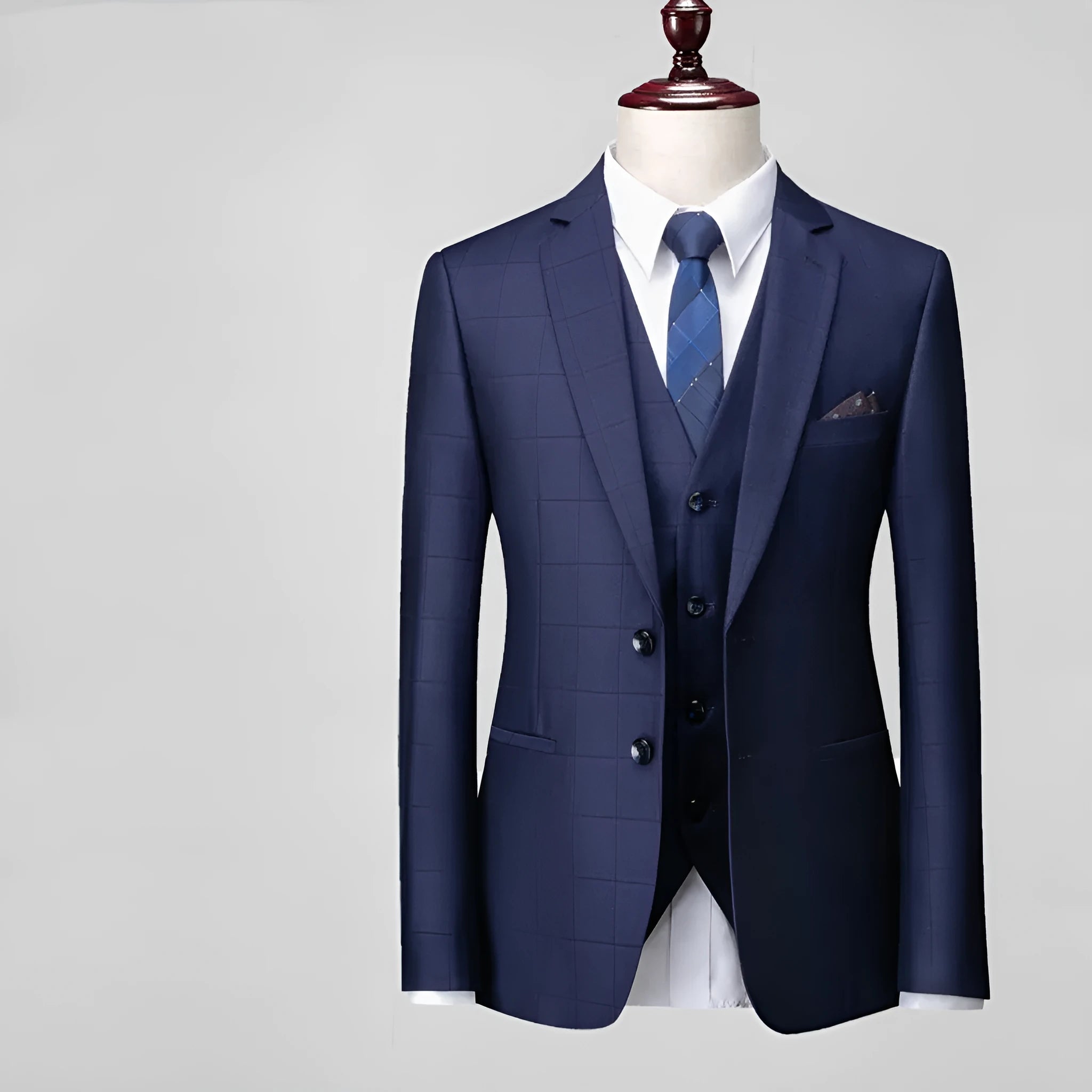 Men's navy blue plaid slim fit three-piece suit featuring a vest, jacket, and trousers on a hanger.