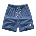 Men's grey drawstring summer leisure shorts on a white background.