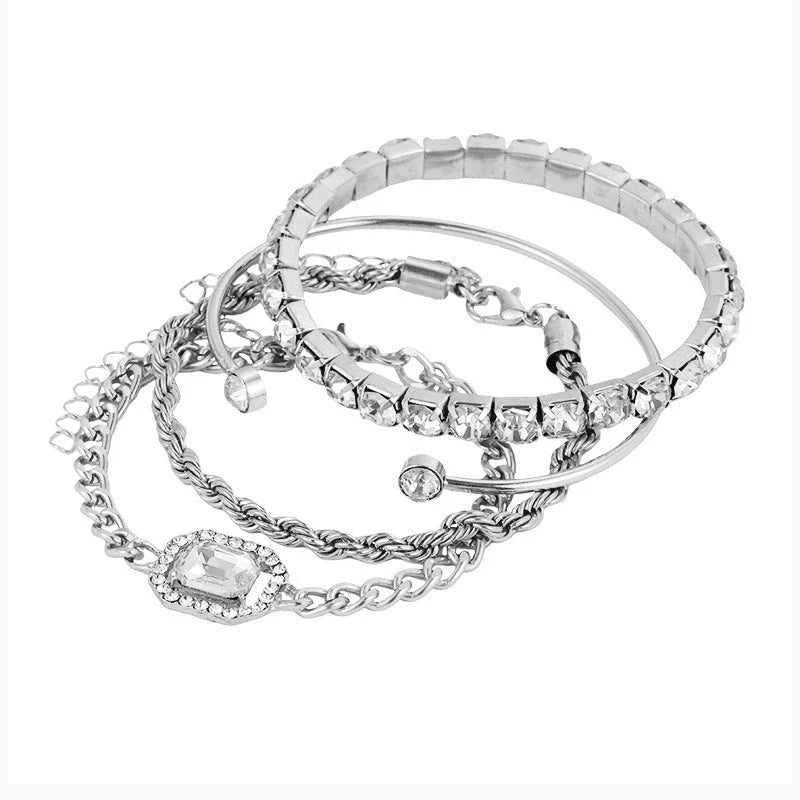 Premium 4-piece crystal bracelet set with adjustable fit and sparkling rhinestone embellishments, perfect for adding a touch of glamour to any outfit.