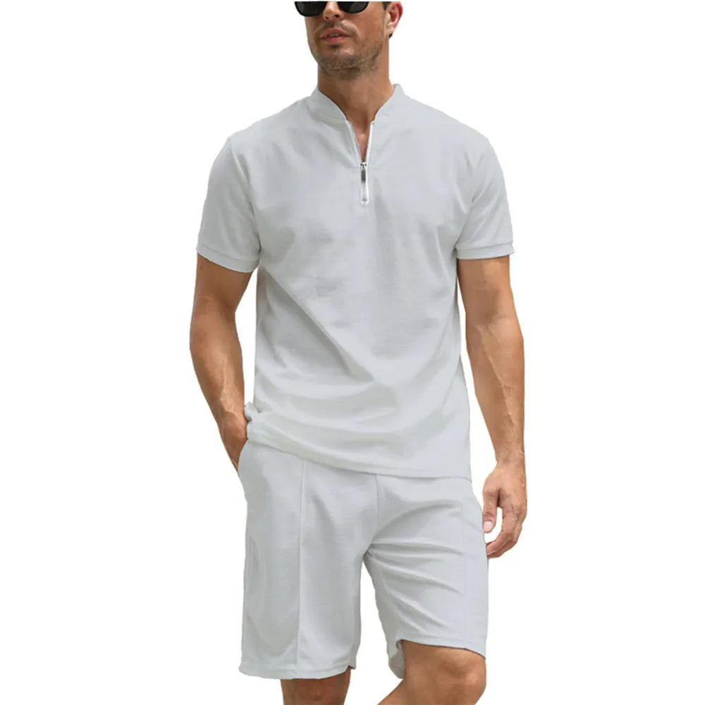 Men's solid colour polo shirt and trousers two-piece casual suit set on a hanger.