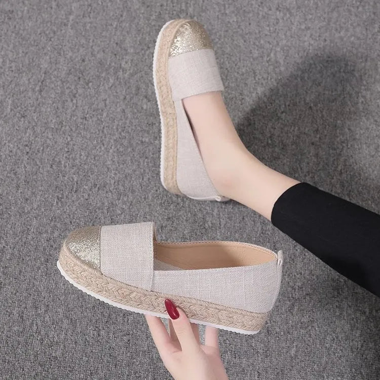 Black plus size breathable canvas flat shoe with round toe and slip-on design.