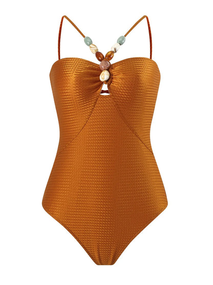Women's one-piece swimsuit with hollow gem sling design in sapphire blue colour