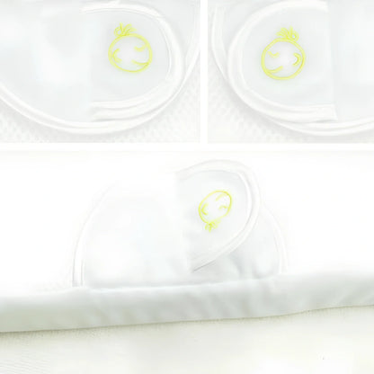 White baby sleep positioning pad with curved armrest and elevated head section