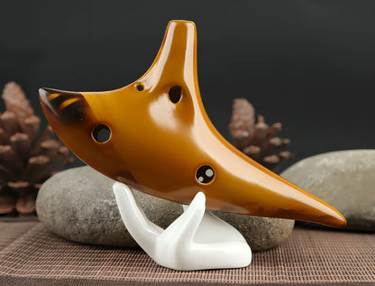 Yellow 12-hole ceramic ocarina in Alto C with 13-note range and integrated lanyard
