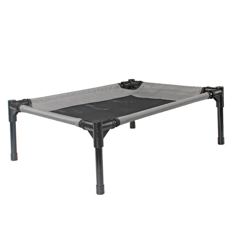 Black portable outdoor dog bed with steel frame and removable Oxford cloth cover, shown on grass.