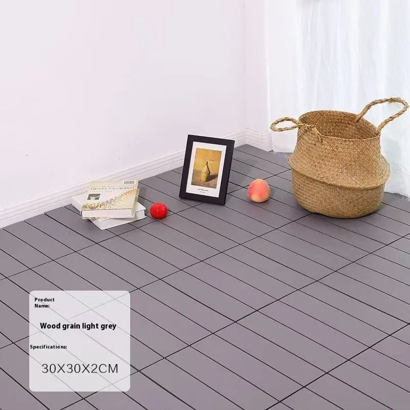 Ten wood grain style plastic floor tiles showing splicing edges and non-slip surface texture.
