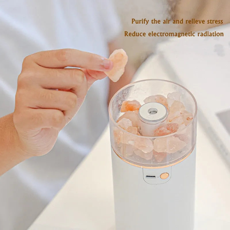 Ultrasonic humidifier diffuser with crystal salt stone and LED lamp in white finish on a desk with USB cable