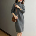 Beige half zip straight skirt with long sleeves and a stand collar, shown on a model.