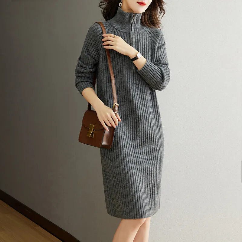 Beige half zip straight skirt with long sleeves and a stand collar, shown on a model.