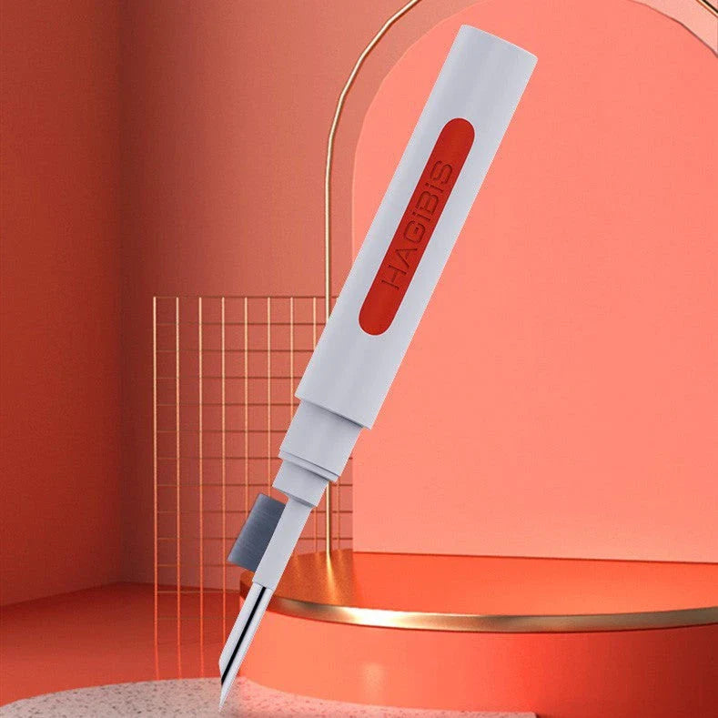 Versatile 4-in-1 keyboard cleaning brush with nylon bristles, flocking sponge, metal pen tip, and keycap puller for efficient cleaning of gaming equipment