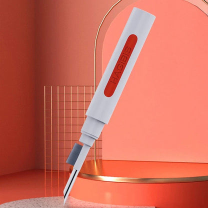 Versatile 4-in-1 keyboard cleaning brush with nylon bristles, flocking sponge, metal pen tip, and keycap puller for efficient cleaning of gaming equipment