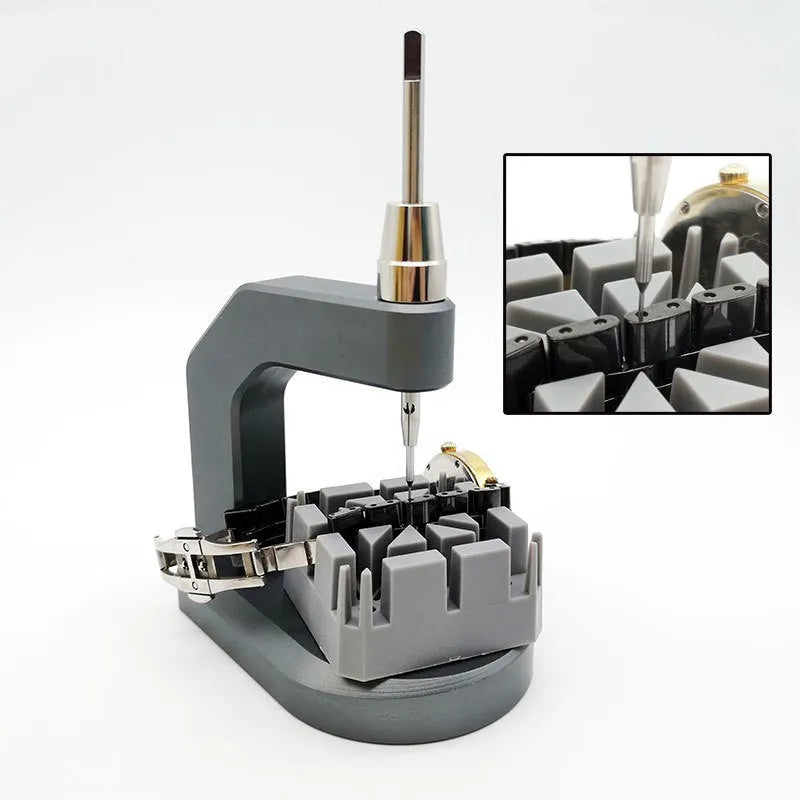 Silver tool steel multi-purpose press strap and pin removal tool on a work surface.