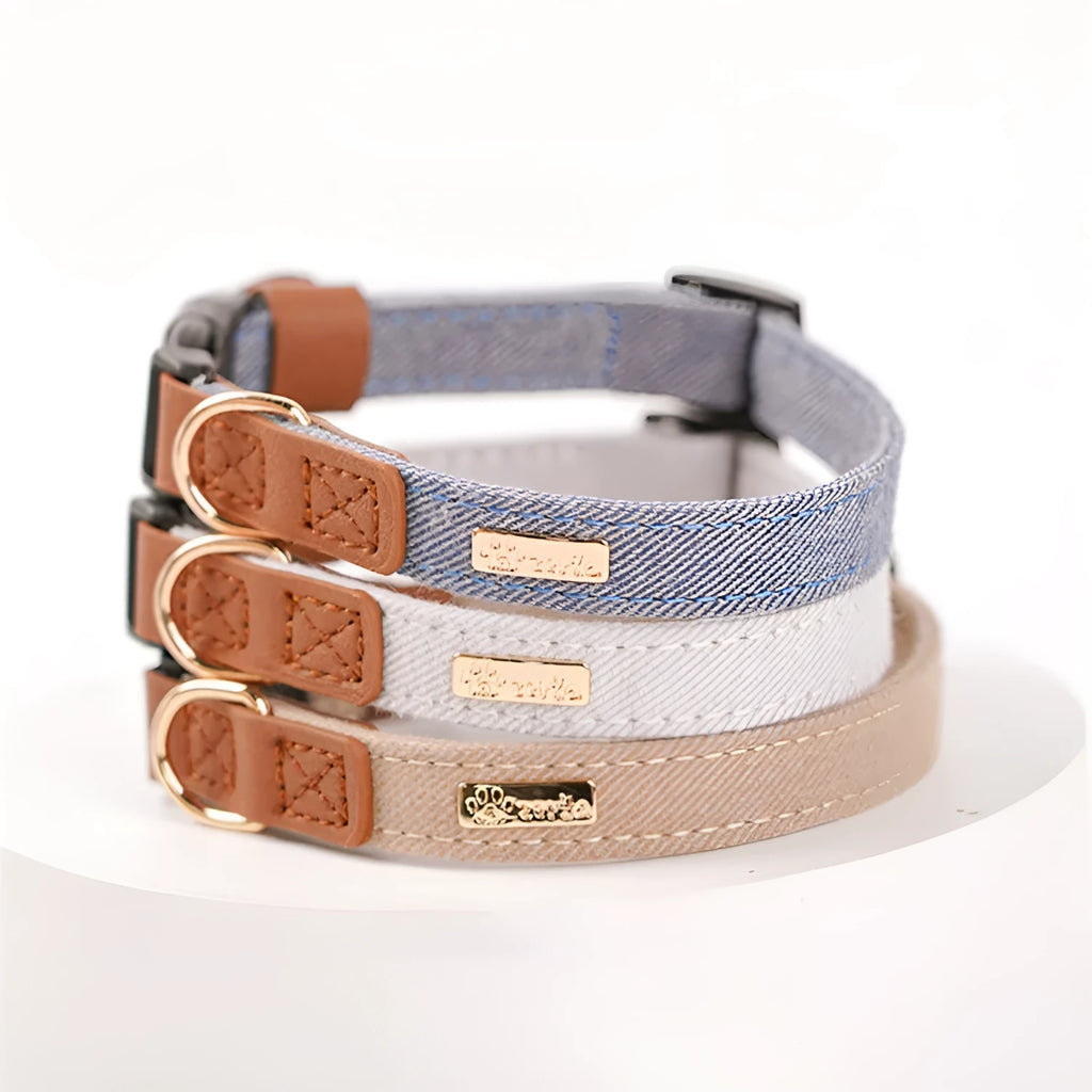Adjustable mohair dog collar with nameplate and hand holding rope in cement gray