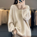Women's camel V-neck long sleeve viscose pullover sweater on a hanger.