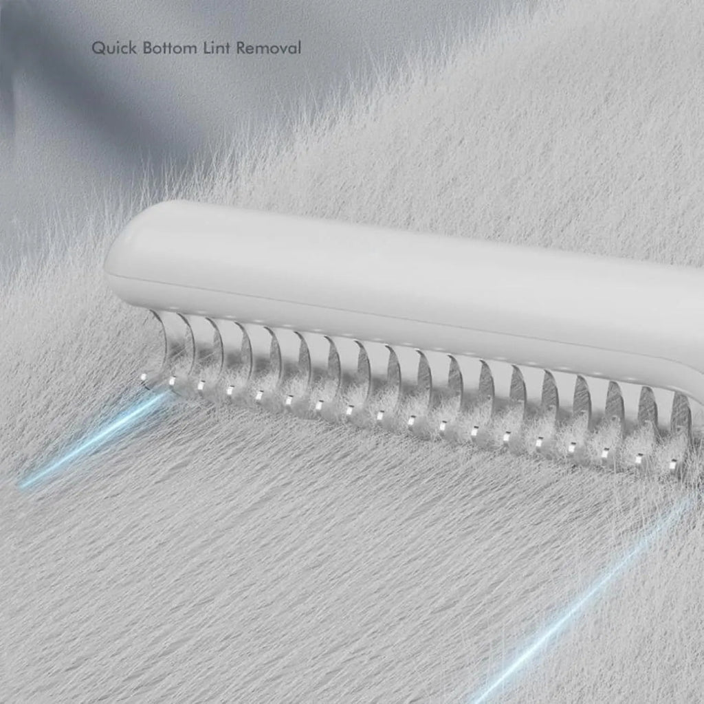 Stainless steel dog dematting comb with ergonomic handle on a pink background
