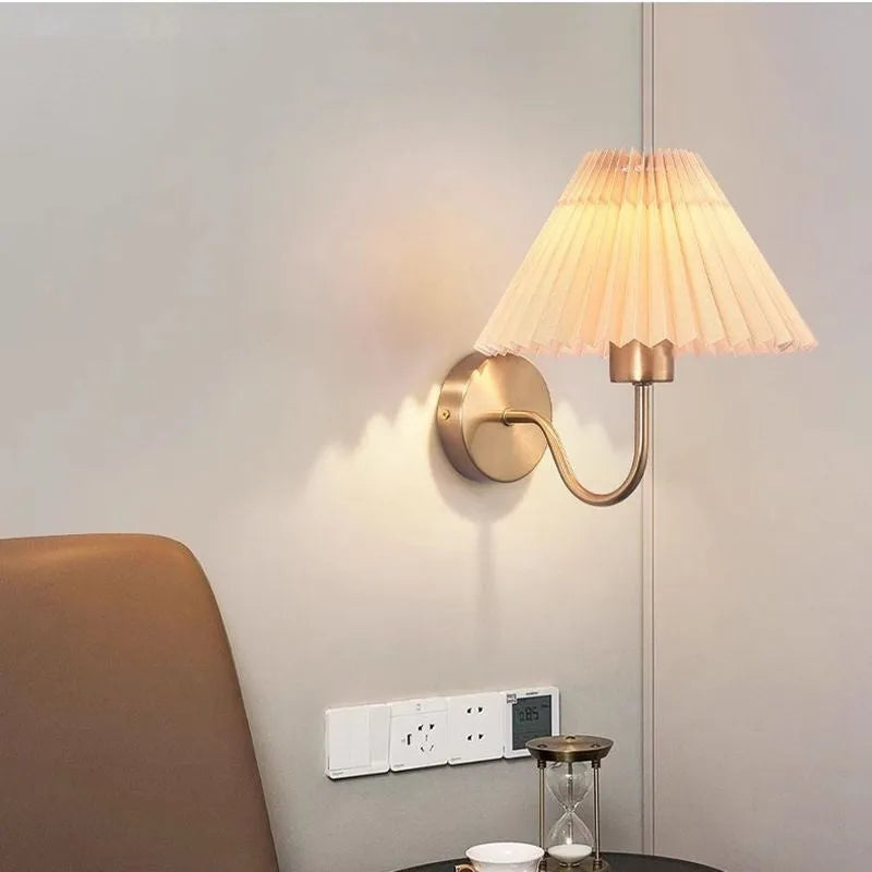 Retro LED wall lamp in iron finish with apricot colour option for bedside reading