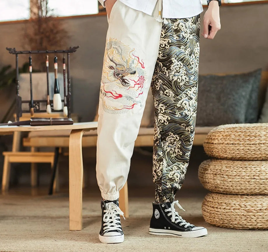Embroidered silver dragon pattern on beige cotton casual trousers with mid-waist design