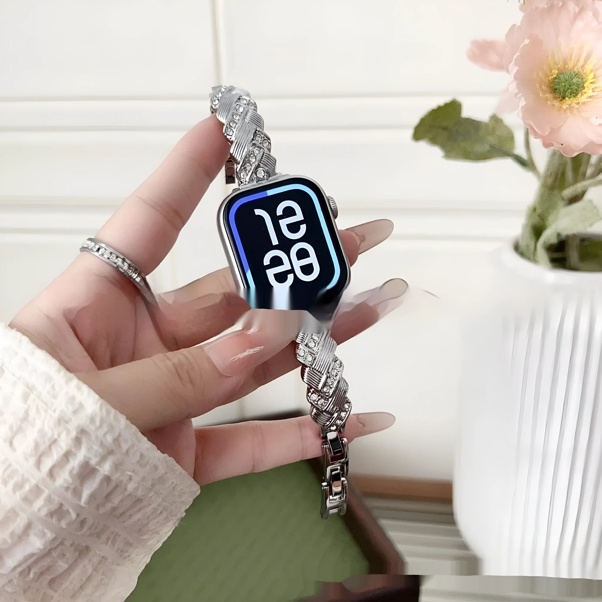 Zinc alloy metal Apple Watch band with twist and diamond design in silver, rose gold, gold, black, and Starlight colours.