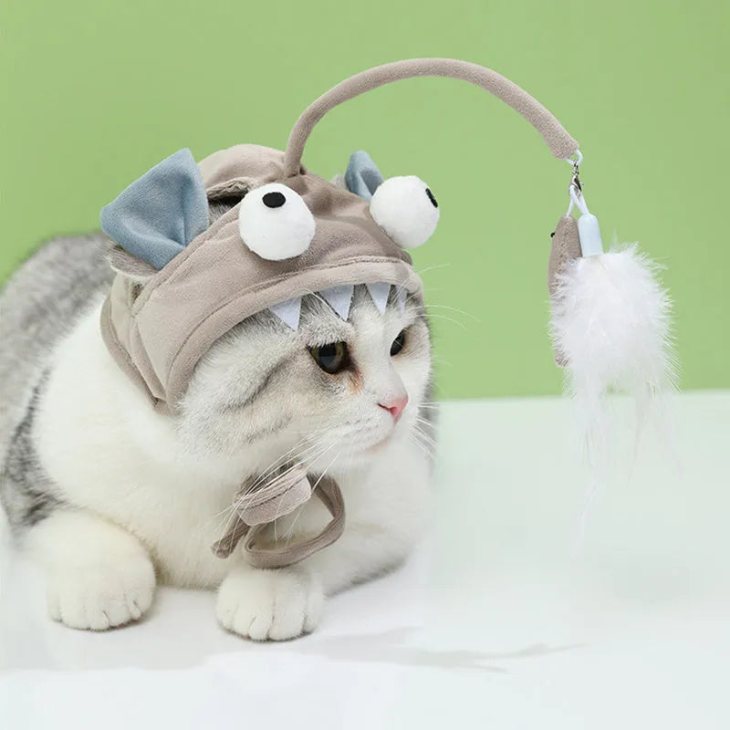 Grey feather head teaser cat stick toy with big eyes, adjustable neckband, shown on a cat.