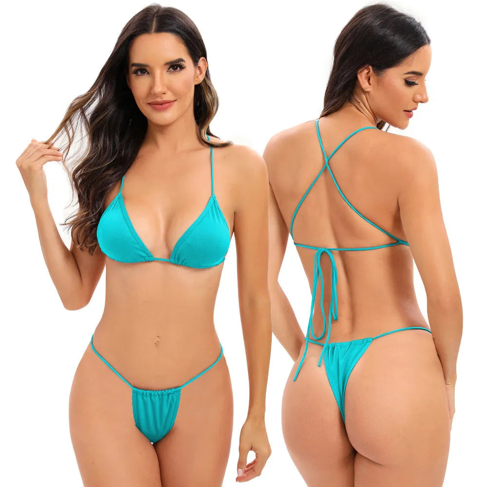 Women's candy coloured cross strap bikini swimsuit with multiple adjustable straps on a mannequin.