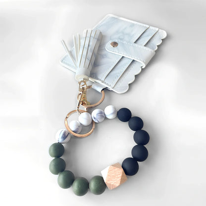 Green wrist strap self-defence key chain with perfume bottle, window breaker, alarm, and stick attachments, 10cm holder