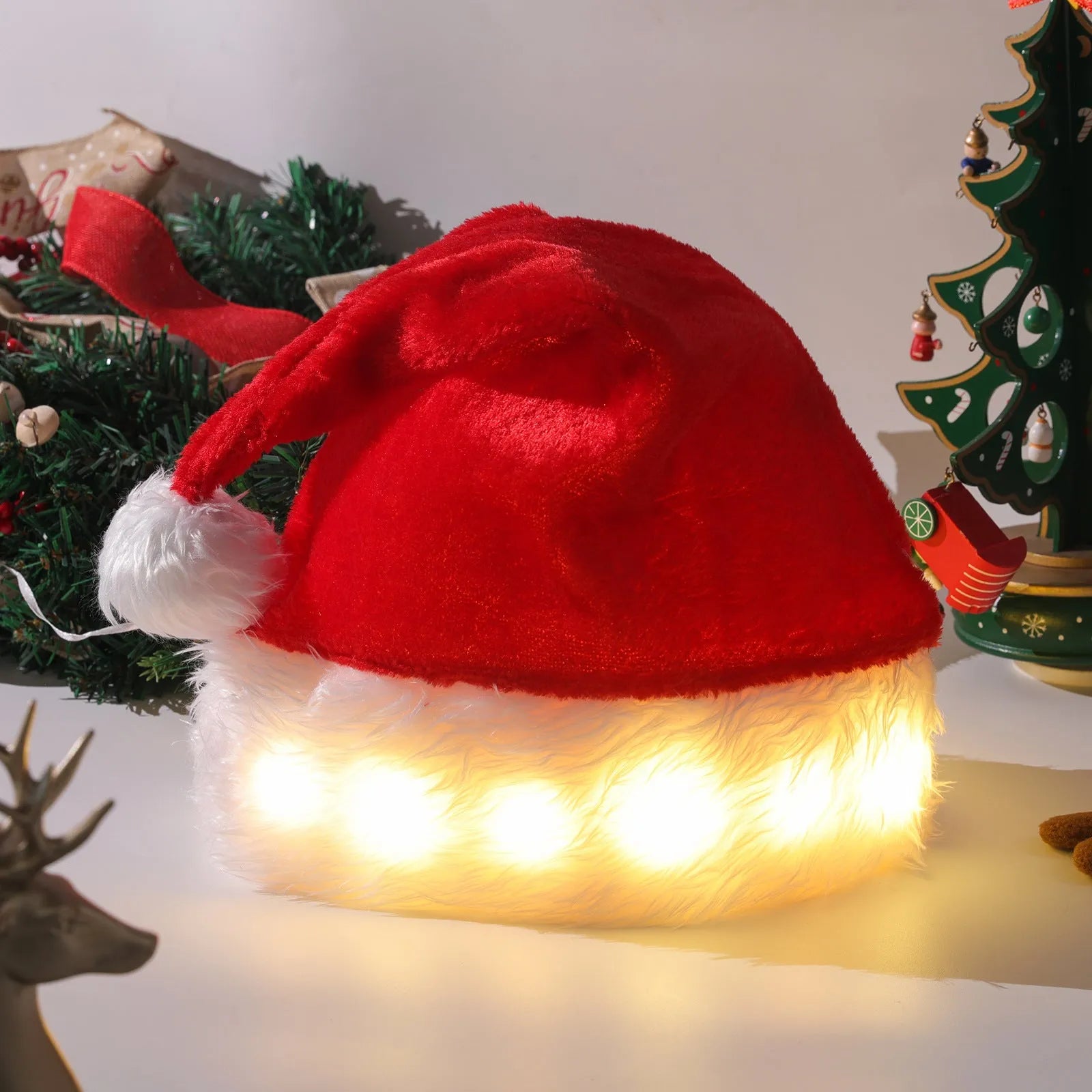 Red and white plush Santa Christmas hat with LED lights illuminated, featuring a pom-pom and stretchy spandex band.