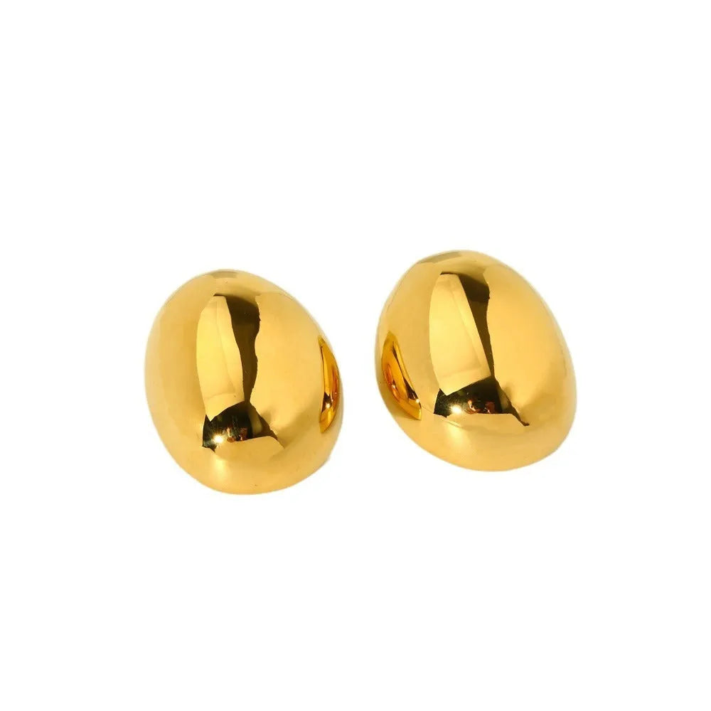 Geometric line design ear studs with stainless steel and 18K plating showing exaggerated glazed surface