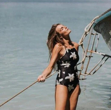 Women's crochet bandage monokini swimsuit with cut-out sections and adjustable tie closures