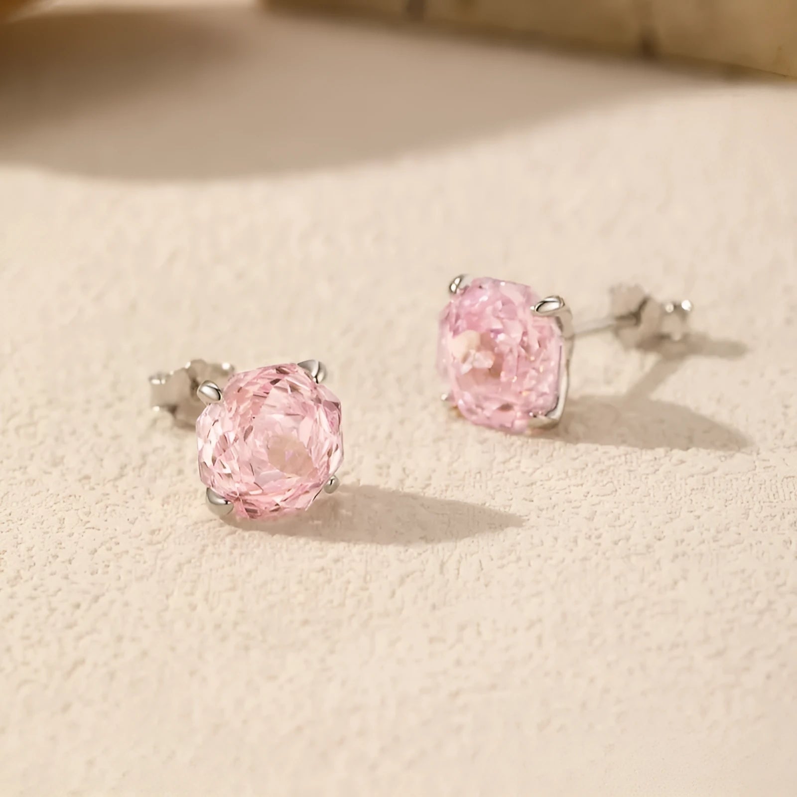 Close-up of S925 sterling silver rose stud earrings for women in pink, showing 6mm and 8mm size options.