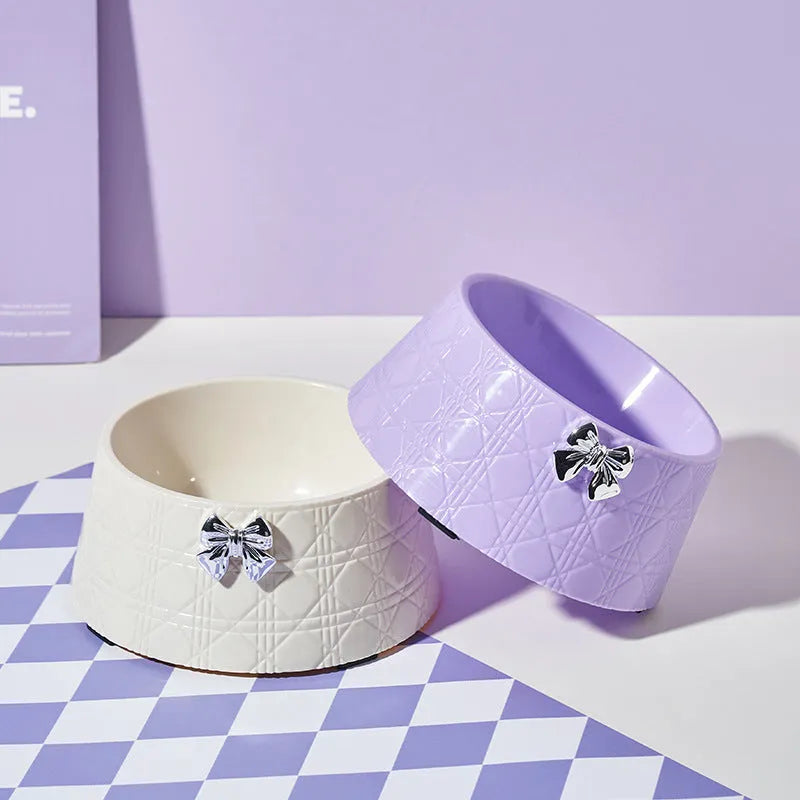 Ceramic pet bowl with bowknot and diamond pattern in pink, silver, black, purple, or white.