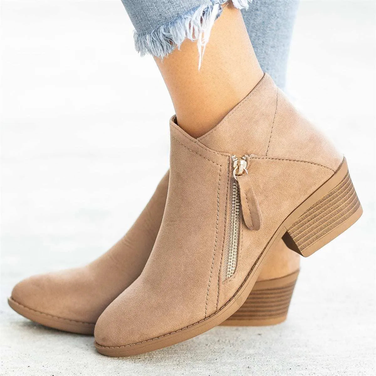 Women's suede chunky heel ankle boots with side zip in blue, shown from the side.