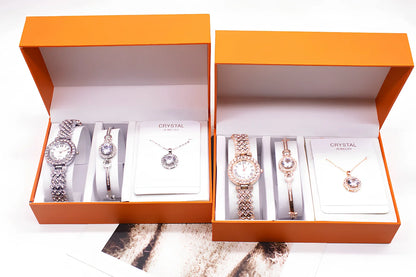 3-piece rhinestone quartz watch set with 22.5cm gold alloy strap, bracelet, and necklace on display