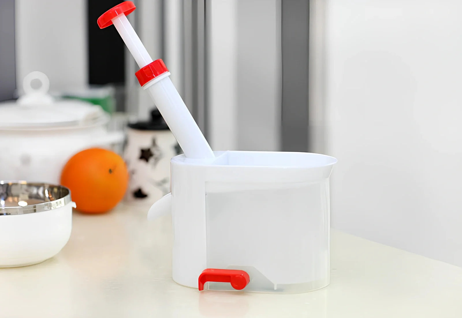 White cherry nucleator fruit cutter with stainless steel blades and plunger mechanism for cutting grapes