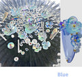 Container of flower and butterfly shaped nail sequins in mixed colours blue champagne grey pink transparent yellow