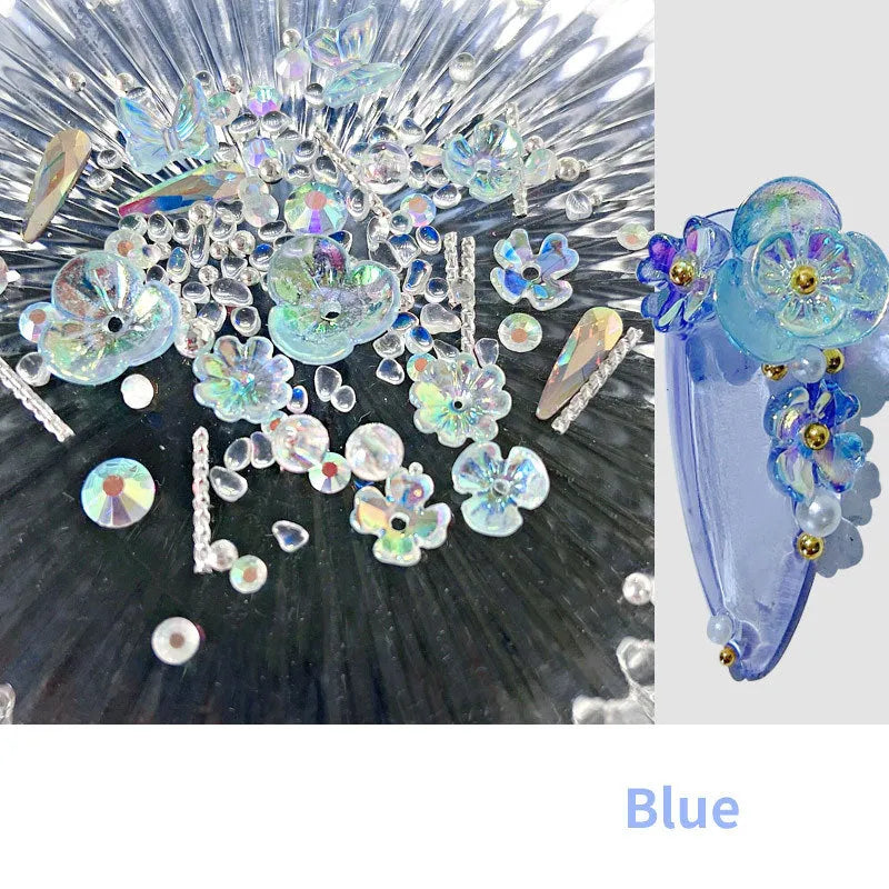 Container of flower and butterfly shaped nail sequins in mixed colours blue champagne grey pink transparent yellow