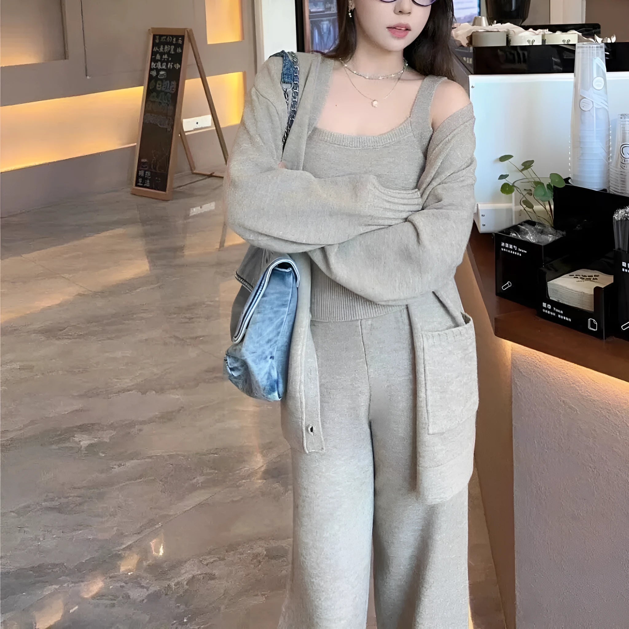 Women's light brown knitted cardigan, vest, and loose pants three-piece casual outfit set.
