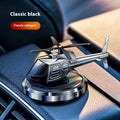 Silver metal solar helicopter car perfume ornament rotating on a car dashboard.