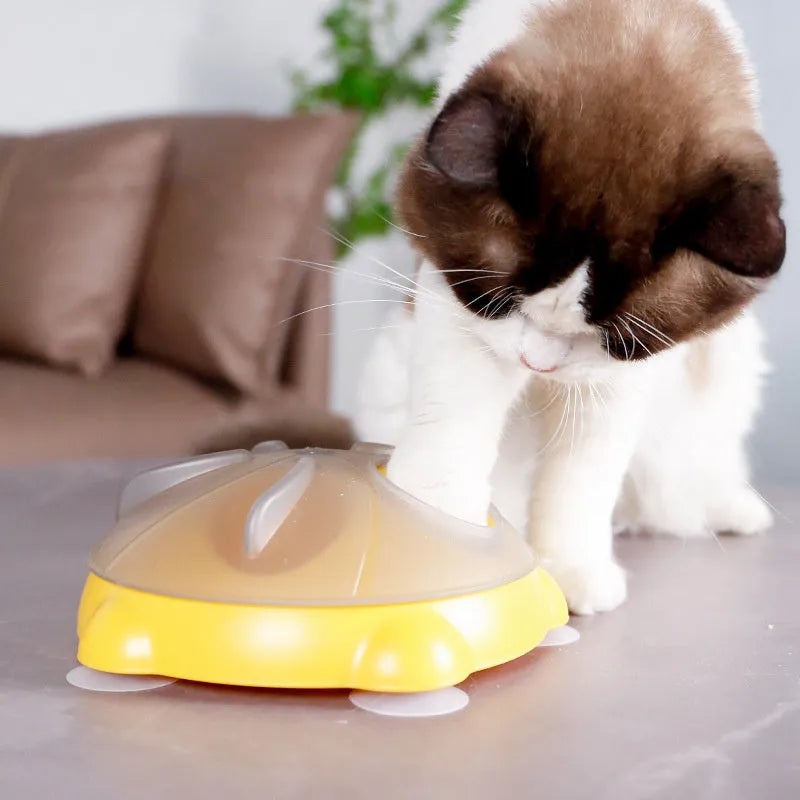 Yellow plastic interactive cat puzzle feeder toy with compartments for treats