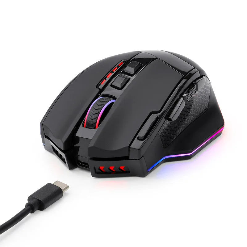 Black Redragon M801P dual mode wireless and wired gaming mouse on a desk.