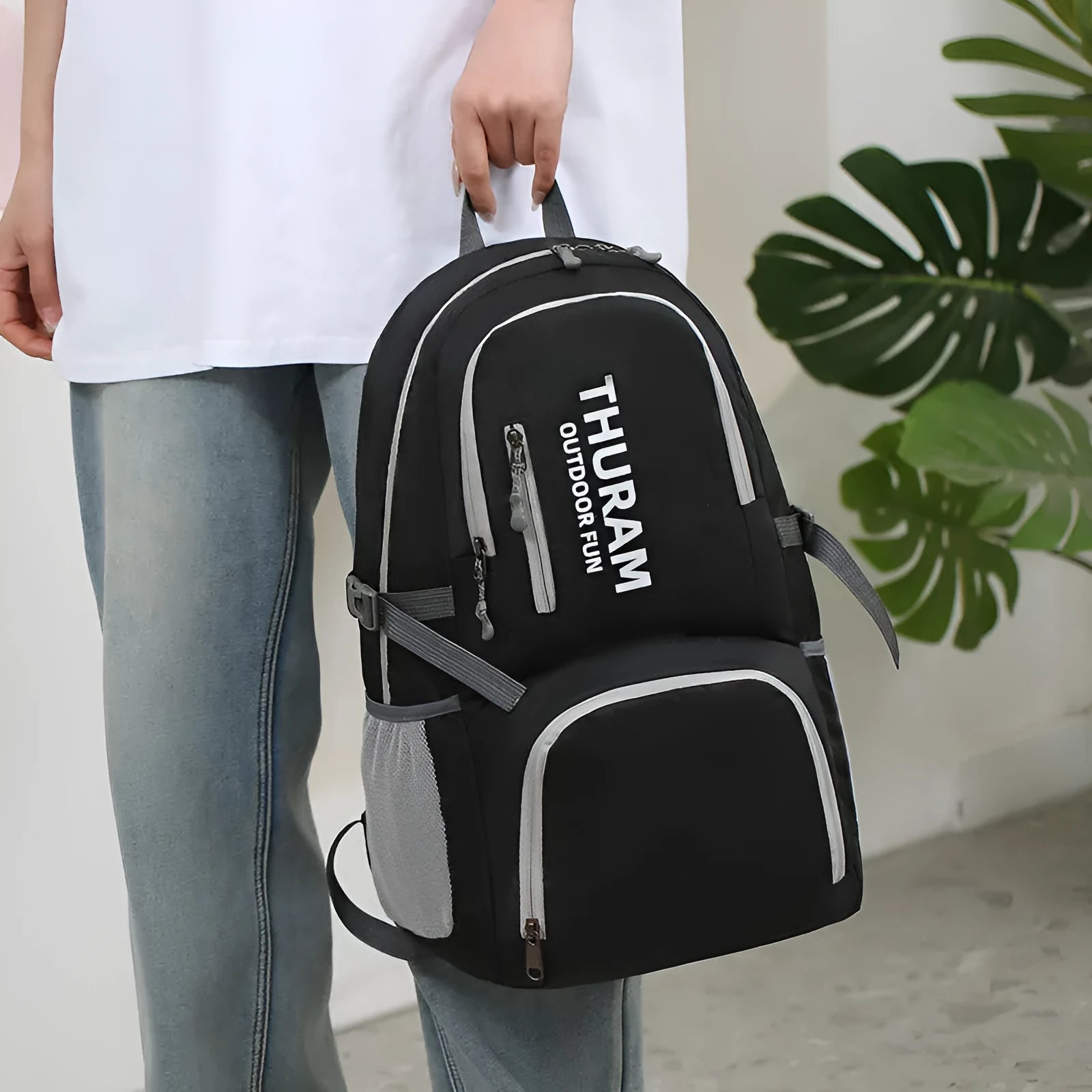 Outdoor folding shoulder travel bag in Oxford cloth with 20-35L capacity and air pillow belt