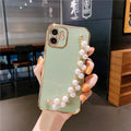 Soft TPU electroplated pearl wrist phone case for Apple iPhone in pink, showing back cover design.