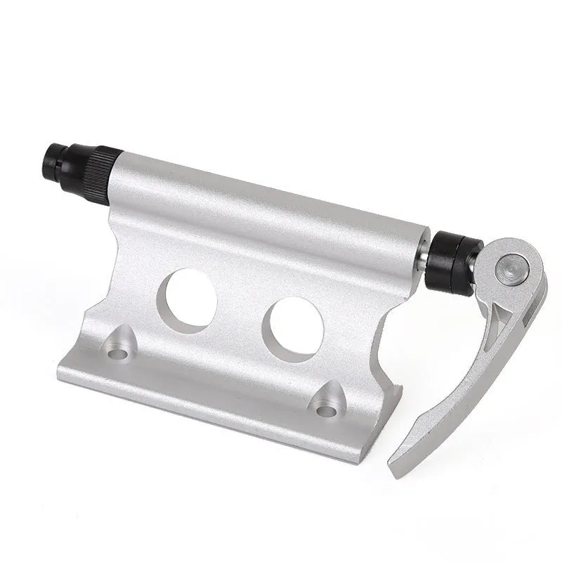 Silver metal quick release fixing clamp for mounting accessories on a bicycle front fork.